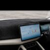 Premium black non-slip dashboard mat custom-fitted for the BYD Atto 2, showing precise cutouts for vents and sensors