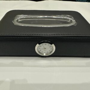 Premium black leather car tissue box holder with integrated analog clock on a dashboard layout Pakistan.