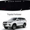 Premium black heat-resistant dashboard mat cover installed inside a Toyota Fortuner