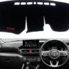 Close-up shot of a premium black custom-fit dashboard mat installed perfectly inside a Toyota Raize, protecting the dashboard from sunlight.