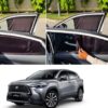 Premium retractable car window curtains installed on a silver Toyota Corolla Cross SUV in Pakistan, showing how the mesh shade can be smoothly slid open or closed.
